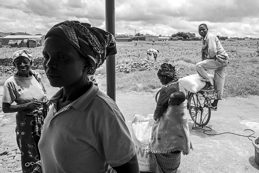 Villagers at a grain center. Dzaleka, Malawi